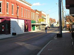 Downtown Horse Cave, December 2006, looking eastward down Main Street/HWY-218. The cave opening is to the right.