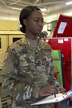 Deshauna Barber tours the motor pool at the Army Reserve Center, Fort Totten