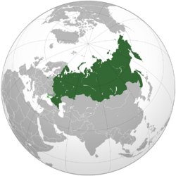 Russia on the globe, with disputed/occupied territory shown in lighter shades of green.