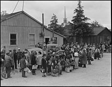 Centerville, California. Members of farm families await evacuation bus. Farmers and other evacuees . . . - NARA - 537574