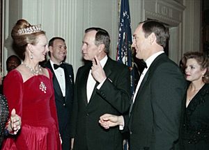 President George H. W. Bush introduces Nolan Ryan to Queen Margrethe II of Denmark at a State Dinner (cropped)