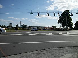 The intersection of State Roads 50 and 471 in the shadow of a saw mill in Tarrytown, Florida.