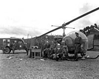 8225th MASH personnel with H-13 helo in Korea 1951