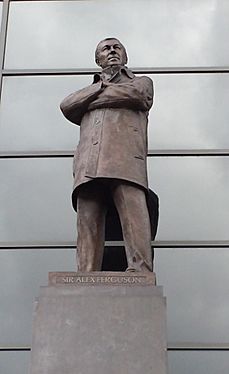 statue of man in long coat