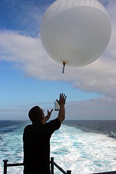 US Navy 040623-N-0995C-001 Aerographer^rsquo,s Mate Airman Harley Houston releases a weather balloon aboard the conventionally powered aircraft carrier USS John F. Kennedy (CV 67), to measure atmospheric conditions