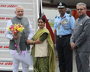 Narendra Modi being received by the Union Minister for External Affairs and Overseas Indian Affairs, Smt. Sushma Swaraj, on his arrival at Palam airport, after his five days official visit to Japan, in New Delhi