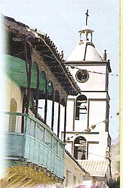 Colonial balcony and tower of the church of Villa Rivero