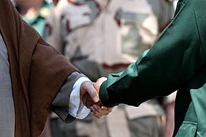Ali Khamenei is shaking hand with his left hand