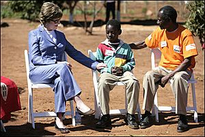 Laura Bush talks with African boy
