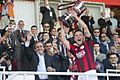 Lincoln Red Imps Captain Lifting 2014 Rock Cup from Michel Platini