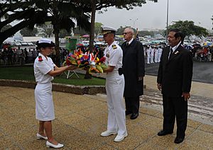 US Navy 090925-N-8721D-037 Capt. Thom Burke, commanding officer of the amphibious command ship USS Blue Ridge (LCC 19) receives a wreath to lay at the U.S. war memorial during a ceremony