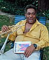Dizzy Gillespie holding memoir "To Be or Not to Bop"