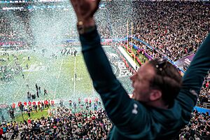 An Eagles fan celebrates as confetti falls on the field at Super Bowl 2018, Minneapolis MN (40074198602)