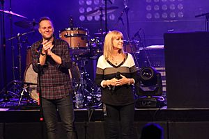 Matthew West on stage with Forgiveness inspiration Renee Napier