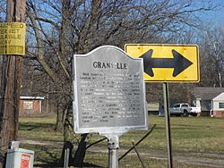 A historical marker in the center of the community