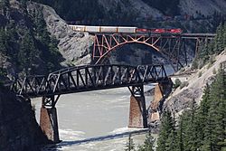 Canadian Pacific Railway train crossing Fraser River on Cisco bridge at Siska, British Columbia (2010-Jun-13)