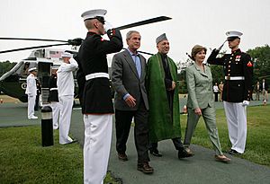 Hamid Karzai with George and Laura Bush at Camp David