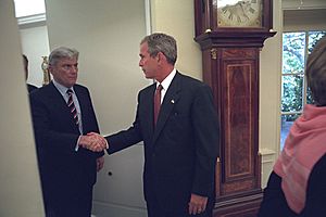 President George W. Bush Shakes Hands with Senator John Warner in the Oval Office