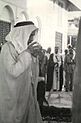 Crown Prince Talal of Jordan in Mecca drinking holy water, 1951