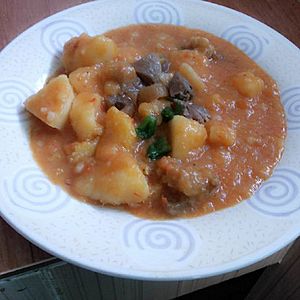 Beef yam porridge with red and green pepper