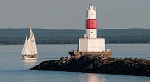 Schooner Coaster II Passes the Presque Isle Harbor Breakwater Lighthouse