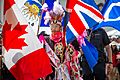 A First Nations representative carries the Union Jack during Canada Day celebrations in Calgary, Alberta - 2022