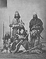 Sardar of the Brahui and four men of his retinue with guns (probably) in the valley of Kalat, anonymous, c. 1866 - in or before 1876