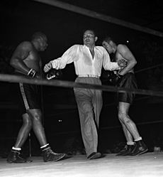 Max Baer referees a boxing match 1937