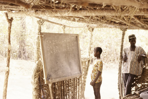 ASC Leiden - Coutinho Collection - C 05 - School in Sara, Guinea-Bissau - Boy in front of blackboard - 1974