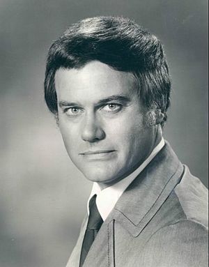 Hagman looking over his should to the camera