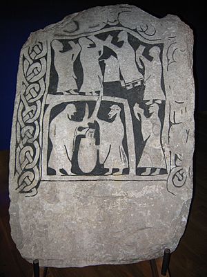 Drinking scene on an image stone