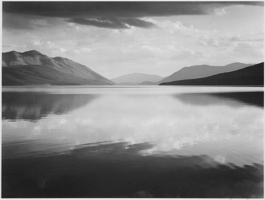 Looking across lake toward mountains, "Evening, McDonald Lake, Glacier National Park," Montana., 1933 - 1942 - NARA - 519861