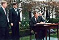 President George H. W. Bush signs the Civil Rights Commission Reauthorization Act in the Rose Garden of the White House