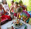 Cutting skull birthday cake for 11 year old. Cooktown. 2016