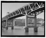 Black and white image of metal bridge