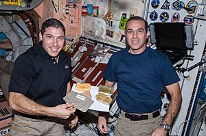 ISS-38 Michael Hopkins and Rick Mastracchio with a Thanksgiving meal