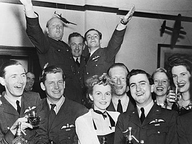 RAF officers and guests celebrating the first anniversary of the arrival of No. 92 Squadron RAF at Biggin Hill, Kent, September 1941. CH4097