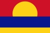 The flag of the Palmyra Atoll has a stylized yellow sun rising in a red sky over blue water with a thin band of yellow sand at the bottom