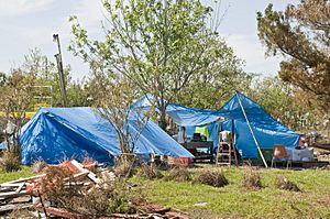 Residents use blue tarps for shelter in Texas