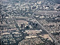 Aerial view of central Orange County overlooking South Coast Metro, John Wayne Airport, and the Irvine business district