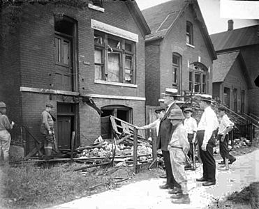 Chicago race riot, white men, boys standing in front of vandalized house