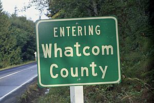 Entering-Whatcom-County sign at county line in Washington, 1970