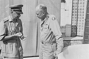 General Alexander, Deputy Commander-in-Chief Allied Forces in North Africa, discussing future operations with the Supreme Commander, General Eisenhower, in Tunisia, 26 July 1943. CNA1074