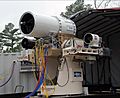 US Navy 100119-N-0365D-001 Members of the Directed Energy and Electric Weapon Systems Program Office fire a laser through a beam director on a Kineto Tracking Mount, controlled by a MK-15 Phalanx Close-In Weapons System