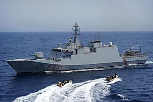 US Navy 100528-N-3136P-207 An Italian Navy visit, board, search and seizure team returns to the Italian Navy offshore patrol vessel ITS Comandante Foscari (P-493)