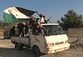 FSA soldiers in truck moving