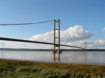 A long suspension bridge over a large expanse of water