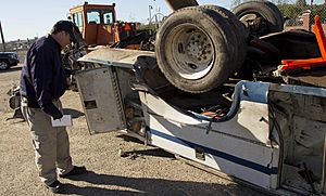 NTSB highway investigator Michael Fox examines truck involved in CA grade crossing accident (16466867269)