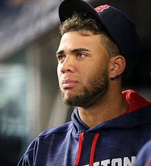 Red Sox prospect Yoan Moncada looks on from the dugout. (29997392685).jpg