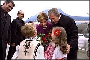 Romanian children greet Bushes 2002